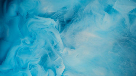 Blue paint drop in white backgroundの写真素材