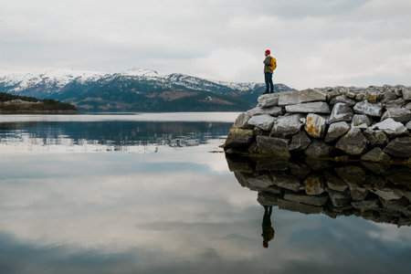 travel and adventure background, hiker with backpack enjoying landscape in Lofoten, Norway