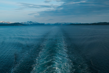 Close up portrait of serious man of Norway pier, background boatの写真素材