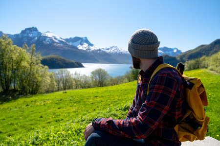 Man Hiker with backpack enjoying viewの写真素材