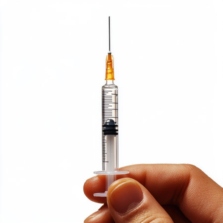 Syringe in Hand with Blue Lightsの素材