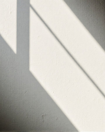 Diagonal pale concrete plane with soft shadowの素材