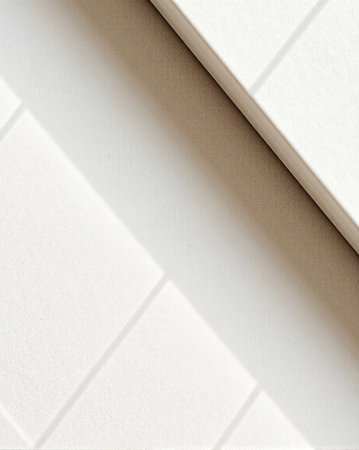 Diagonal fold revealing warm cream paper edgeの素材