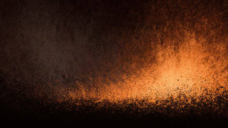 Dark stage with warm golden particle burstの素材