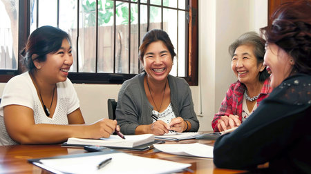 Group of Asian women working together at the desk in a meeting.の素材