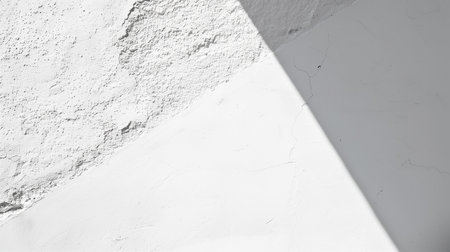 White wall with shadow. Abstract background and texture for design. Copy space.の素材