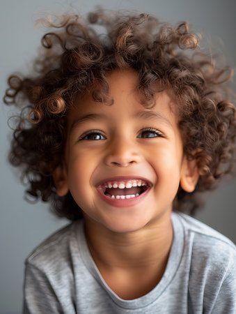 Portrait of a cute African American little boy with curly haiの素材