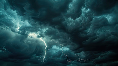 dramatic moment of a lightning strike across the dark cloudy sky.の素材
