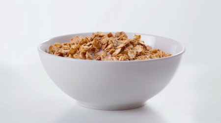 simplicity and freshness of a cereal bowl with milk, isolated on a clean white background.の素材