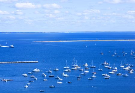 White yachts in blue water of Provincetown, Cape Cod, MA.の写真素材