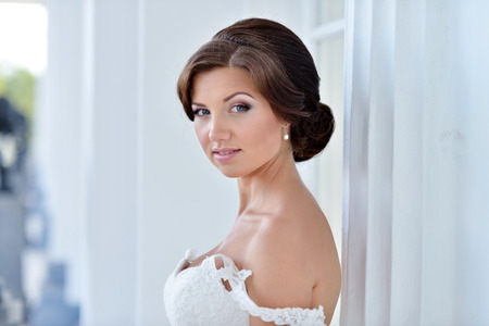 Beautiful model girl in a white wedding dress.の写真素材