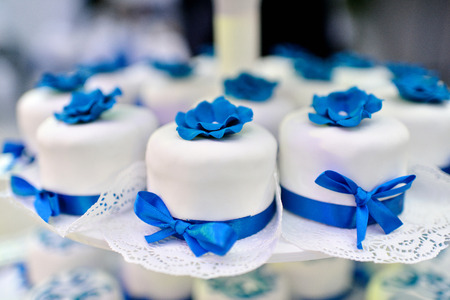 Beautiful wedding cake for bride and groom indoors. Colorful pie for celebration. Beauty of bridal interior for marriageの写真素材