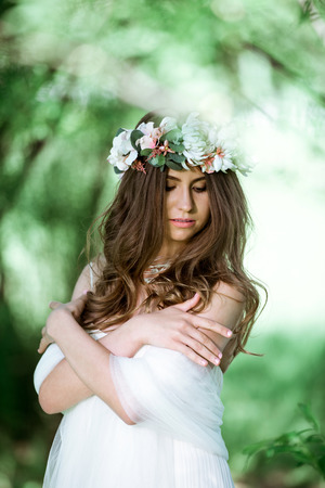 Brunette bride in fashion white wedding dress with makeupの写真素材