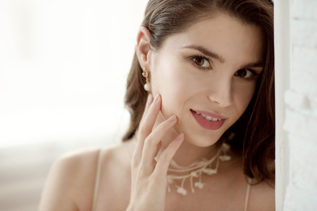 Closeup brunette bride with fashion wedding hairstyle and makeupの写真素材