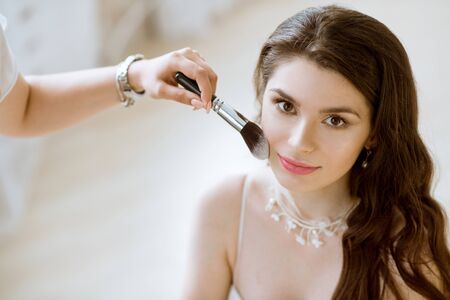 Wedding makeup artist making a make up for brideの写真素材