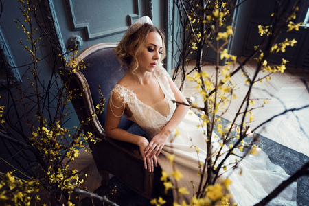 Blonde bride in fashion white wedding dress with makeupの写真素材