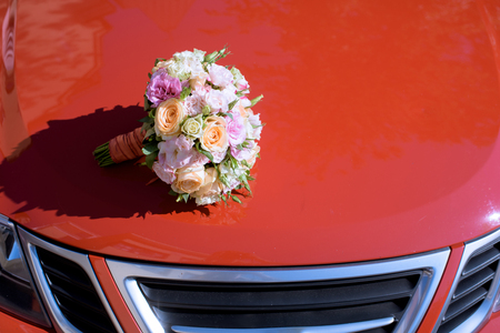 Beautiful wedding colorful bouquet and car for brideの写真素材