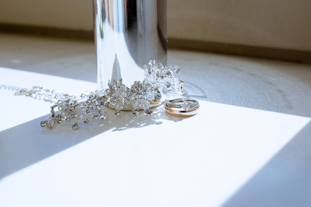 Beautiful wedding rings and perfume bottle for bride and groomの写真素材