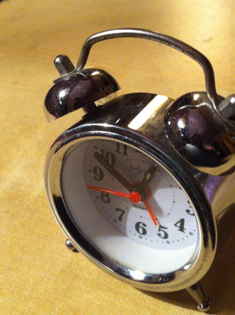 Metal clock under the light