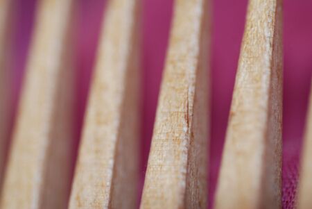 A close-up of a wooden comb, short depth of fieldの写真素材