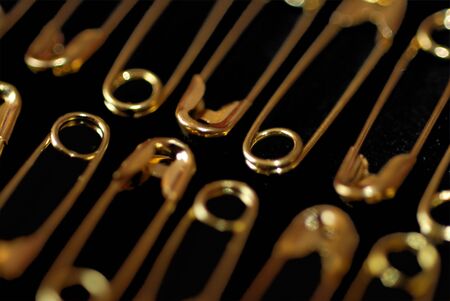 Extreme close up of gold safety pinsの写真素材