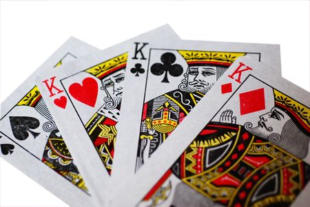 A fan of four Kings playing cards, isolated on a white backgroundのeditorial素材