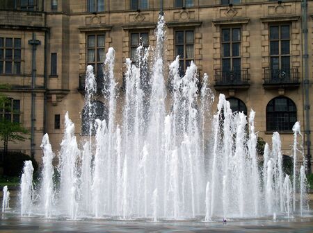 A photograph of water jets in front of the old Town Hall building in Sheffield, England.の写真素材