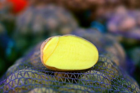 potatoes in bags on the marketの写真素材