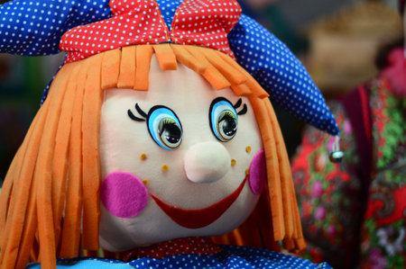 beautiful smiling doll at the grocery fair on the counter horizontal photo