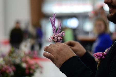 Hand Arranging Flower At school on a blur-blurred background horizontal photo