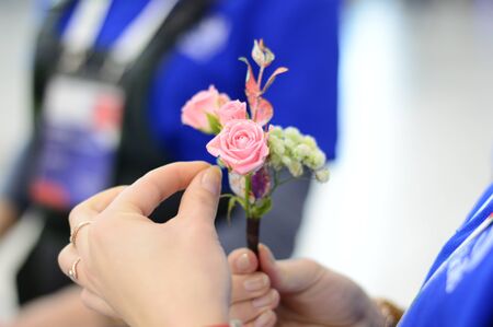 Hand Arranging Flower At school on a blur-blurred background horizontal photoの写真素材