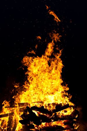 Hot camp fire of wood burning in the darkの写真素材