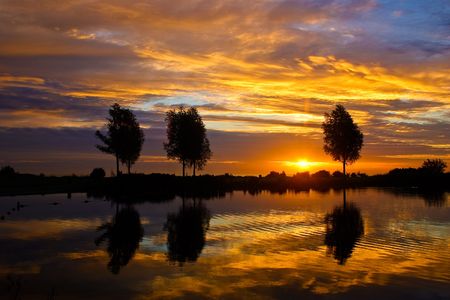 Landscape with water at sunset in beautiful colorsの写真素材