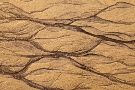 Artistic shapes in the sand on the beachの写真素材