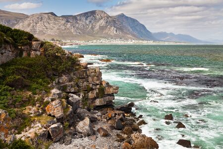 Beautifu rocky coastline with mountains in South Africaの写真素材
