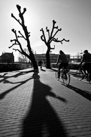 Bikers on the street in the city on a sunny dayの写真素材
