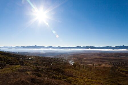 Mountain village in a landscape on a sunny morningの写真素材