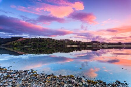 Colorful sunrise at a lake in Scotlandの写真素材