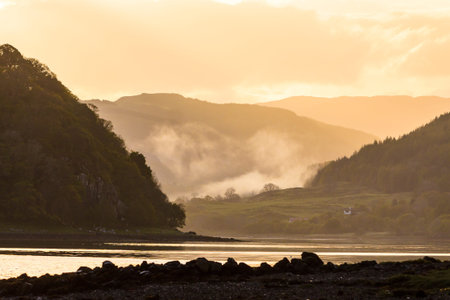 Morning mist at sunrise in the highlands of Scotland