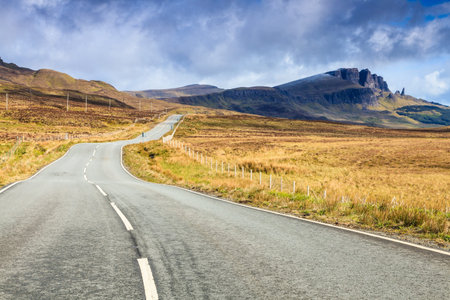 Empty highway through a desolate landscape in Scotland