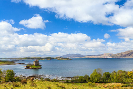 Medieval castle on a island in the waterの写真素材
