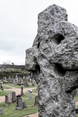 Old celtic grave stone on a graveyardの写真素材