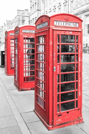 Row of traditional red phone booth in englandの写真素材