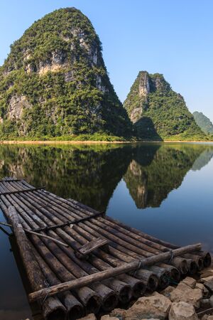 Bamboo raft at Li river with limestone hills in South Chinaの写真素材