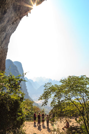 Tourist standing at moon hill looking down, South China