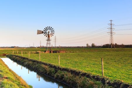 Water windmill in a typical dutch landscapeの写真素材