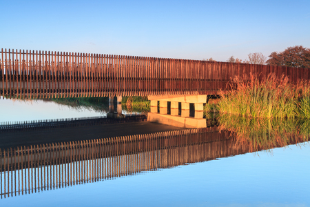 Bridge over water in early colorful morning lightの写真素材