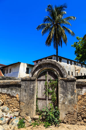 Old decayed entrance door of an house in Stone Town, Zanzibarの写真素材