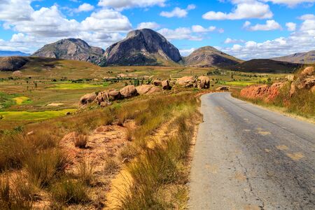 Landscape with road and rock formation in central Madagascar on a sunny dayの写真素材