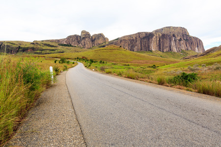 Empty road in a rocky mountain landscape in Africa ona grey cloudy dayの写真素材